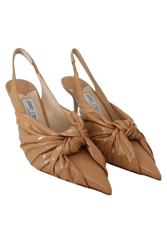 Gloednieuw met labels stofzak en schoenendoos
  100% authentieke Jimmy Choo Pumps
  Ontwerp met spitse neus
  Model: Caramel Annabell 85 sop leren pumps
  Kleur: Caramel
  Materiaal: Zacht lakleer
  Haklengte: 85 cm / 34 inch