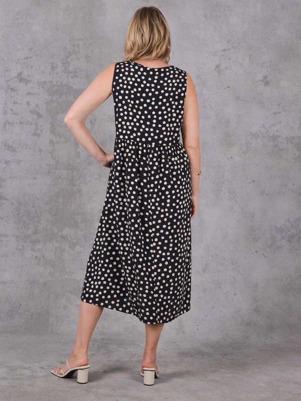 Details

V-neck

Flowing skirt

Garment Care

Composition:  100% Polyester

Machine washable

Sizing

Model height: 5ft 10inches/178cm
Length from back neck to hem: 123cm

This is the prettiest summer dress, and one you can dress up or down with ease. In a classic black &amp; white spot print, it has a sleeveless, V-neck shape with a flowing skirt. Its cut from a woven fabric that moves beautifully, making this piece as flattering as it is cool and comfortable.