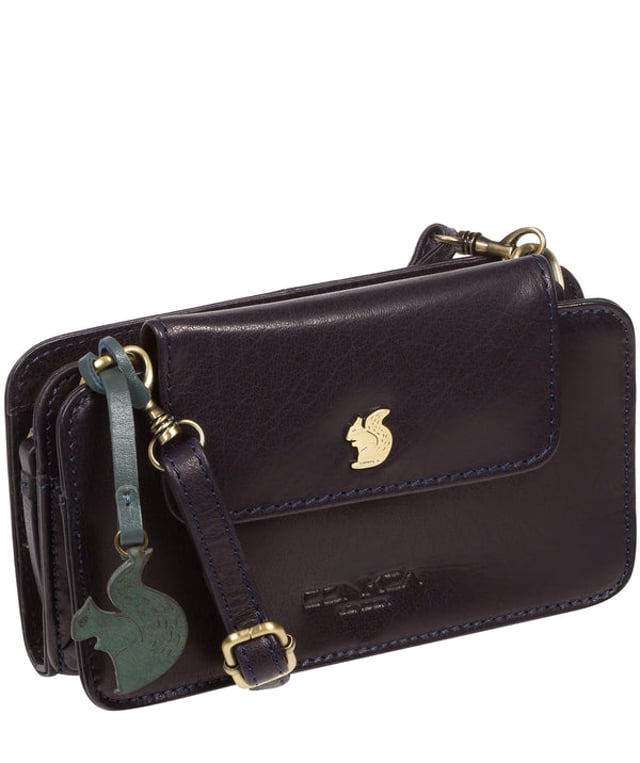The 'Little Wonder' cross body clutch bag from Conkca London is handcrafted from multi-toned leather for a beautiful finish. A magnetic press-stud secured cover opens to reveal a compartment ideal for a smartphone. A zip-over top opens to reveal a second compartment that is perfect for your essential items and has three handy card slots. Lined with natural and untreated 100% cotton. It comes with an adjustable leather strap with a maximum drop length of 68cm, which is removable, converting the bag into a clutch bag. Adorned with the inimitable Conkca squirrel charm and Conkca logos.