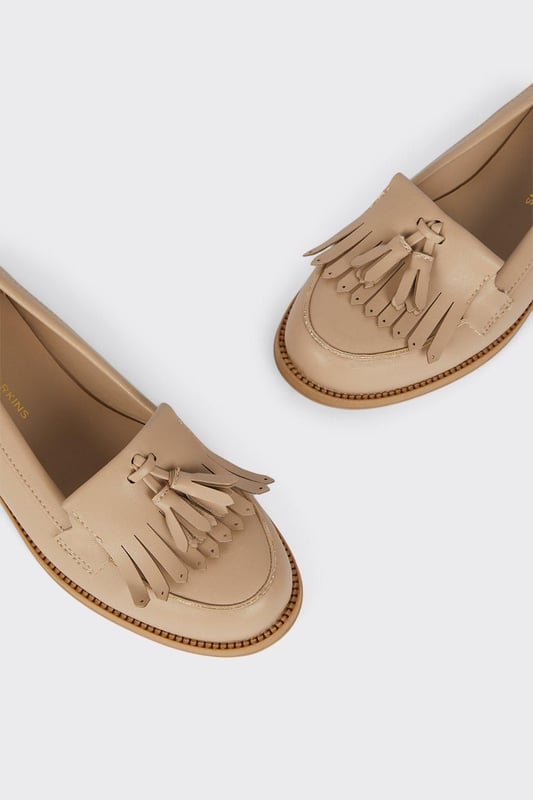 Faux leather loafers with a wide fit for added comfort
Sleek and polished design with a fringed tassel detail
Flat sole offers a versatile wear from day to night
Slip-on style for easy on and off
Synthetic lining and outsole for durability

Exude effortless sophistication with these Wide Fit Leigh Fringe Loafers from Dorothy Perkins. The faux leather construction lends a luxurious touch, while the fringed tassel detail adds a playful twist to the classic silhouette. Designed with a wide fit, these loafers offer ample room for all-day comfort. Pair them with tailored trousers for a polished office look or team them with a flowy dress for a chic weekend ensemble. Their flat sole ensures versatility, allowing you to transition seamlessly from desk to dinner.