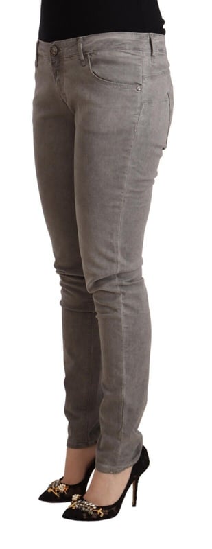 Brand: ACHT
  Material: 98% Cotton 2% Elastane
  Color: Gray washed
  Fit: Slim
  Waist: Low
  Closure: Zipper and button
  Style: Skinny Denim
  Details: Logo details
Material: 98% Cotton 2% Elastane