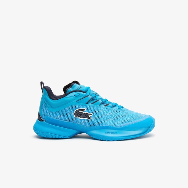 A new model this season  the AG-LT23 Ultra is designed to push tennis players’ abilities further than ever before with their lightweight and responsive design. From the Pebax technology that provides energy return  via the LSRFoam forefoot midsole  in combination with the enhanced stability offered from the TPU Plate Chassis and Heel Stabiliser  to the engineered breathable leno ‘Pique’ weave mesh upper for enhanced fit & breathability  they’re the innovative shoe every player needs to up their game. The outsole features Lacoste's brand new rubber compound; LineGrip. - Pro level performance Tennis shoe offering enhanced stability - Engineered breathable leno ‘Pique’ weave mesh upper for enhanced fit & breathability - Internal midfoot lockdown cage - Lacoste Super Responsive (LSR) Foam midsole in the Forefoot - High Performance EVA Foam in the Heel for enhances shock absorption - Full-length TPU plate chassis and heel stabilizer - 'LineGrip' Rubber Outsole - Ref: 745SFA001111C