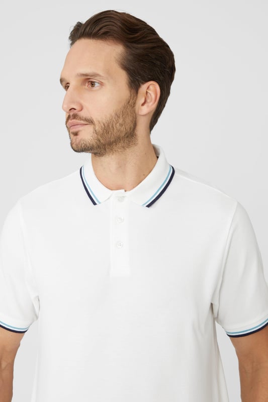 Introducing our Pique Tipped Polo, the perfect addition to any man's smart casual wardrobe. Crafted with meticulous attention to detail, this polo offers a sophisticated and polished look. The pique fabric provides a comfortable and breathable feel, making it ideal for all-day wear. With its stylish tipped collar and cuffs, this polo adds a touch of elegance to any outfit. Whether you're heading to the office or out for a casual gathering, our Pique Tipped Polo is the ultimate choice for a smart and effortlessly stylish look.