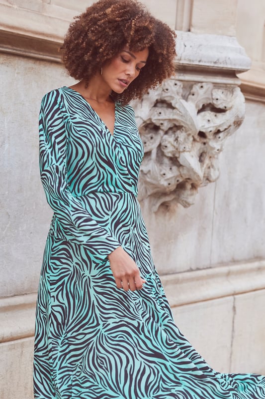 Fuel your animal print obsession
Wrap design to cinch your waist
Pleat detail hem swishes beautifully
Batwing sleeves create a standout silhouette
For brunch or a big night out
Think platforms for dancing, knee-highs for day-to-night chic