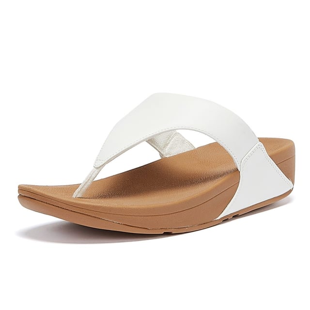 The minimalist Lulu sandals from FitFlop feature a timeless fabric-lined triangular vamp, along with legendary ergonomic Microwobbleboard™ midsoles, which deliver extraordinary comfort by not only absorbing shock but by diffusing underfoot pressure. This iteration boasts softly padded leather uppers for a classic finish.