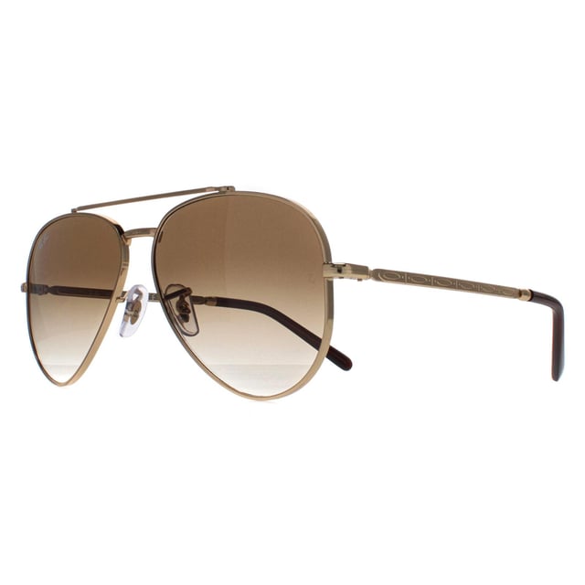 Ray-Ban Aviator Unisex Polished Gold Light Brown Gradient RB3625 New Aviator  Sunglasses are a fusion of classic design and modern innovation. With a nod to the iconic aviator silhouette, these sunglasses feature a sleek metal frame and bold double bridge, delivering a contemporary twist on a beloved style. The updated, slightly squared lenses offer a fresh take on the traditional aviator shape, exuding confidence and sophistication. Crafted with precision and attention to detail, these sunglasses not only make a fashion statement but also provide exceptional UV protection, ensuring both style and eye safety.