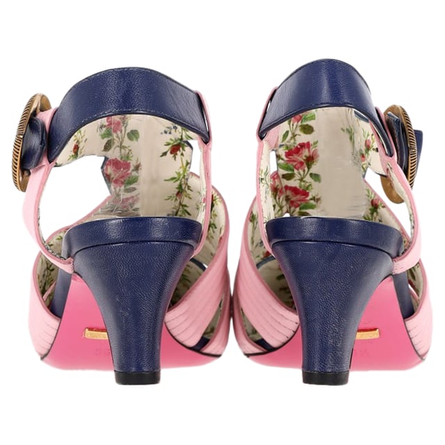 VINTAGE, RRP AS NEW
Step into luxury with the Gucci GG Logo T-Strap Mid-Heeled Sandals in vibrant blue and pink leather. These eye-catching sandals feature the iconic GG logo, beautifully blending high fashion with playful color. The T-strap design provides a flattering silhouette, while the mid-heel offers comfort and stability for all-day wear. Perfect for dressing up a casual outfit or adding flair to an evening ensemble, these sandals are a versatile addition to your footwear collection. Elevate your style and make a bold statement with these stunning Gucci sandals.

Gucci GG Logo T-Strap Mid-Heeled Sandals in Blue and Pink Leather

Condition: Very good
Signs of wear: Minor signs of wear
Packaging: Dust bag
Color: Multicolor
Material: Leather | leather
Size: EU36.5/UK3.5/FR37.5/IT36.5/US6.5
Measurements: Heel height: 80; Insole length: 260
SKU: NAPPUGBSH400793W