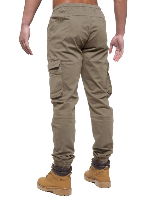 Enzo Mens Elasticated Waist Stretch Cuffed Jeans. Features a 5 Pocket Design. 2 Slash Pockets, 1 Back Pocket 2 Front Cargo, Bellow Side Pockets With Velcro Fastening. Elasticated Waist With Adjustable Drawstings. Cut and Sew Design On Leg. Cuffed Ankle