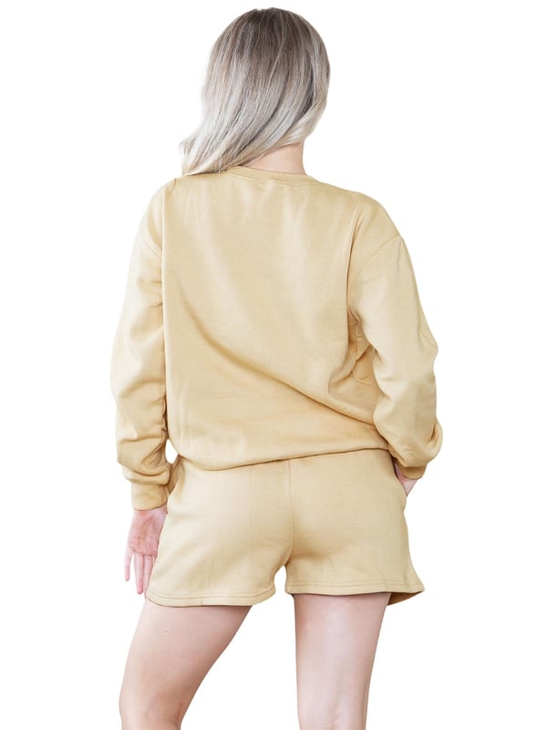 Introducing the Kruze Womens Tracksuit Set: a stylish and comfortable tracksuit set for women. The regular fit crew neck sweatshirt features ribbed waist and cuffs, while the soft fleece lining adds an extra layer of comfort. The accompanying shorts also feature a regular fit and an elasticated waistband with an adjustable drawstring for the perfect fit. Elevate your activewear game with this must-have set!
