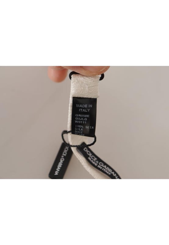 Color: White
  Model: Tied
  Material: 100% Silk
  Adjustable length neck strap one size
  Made In Italy
  Width: 4cm
Material: 100% Silk
