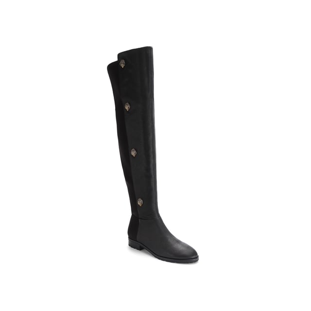 The Kurt Geiger Shoreditch boot features a grained leather upper which sits above the knee. The outer side of each boot features four antiqued brass eagle heads with crystals.