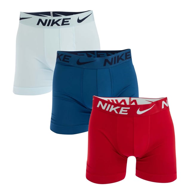 Mens Nike Dri-FIT Essential Micro 3 Pack Boxer Trunks in Glacier Blue - Court Blue - Gym Red.- Comprises one pair x Glacier Blue  one pair x Court Blue  one pair x Gym Red boxer trunks.- Smooth  sweat-wicking microfibre.- Nike Dri-FIT technology helps you stay dry and comfortable.- Stretch material enhances your freedom of movement.- Wide hems help keep underwear in place.- Nike branding at waistband and left leg.- 92% Reprocessed polyester  8% Elastane.  Machine washable.- Ref: 0000KE1156X29We regret that underwear is non-returnable due to hygiene reasons.