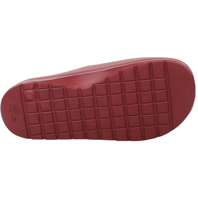 The Lacoste Serve Slide 2.0 223 2 CMA Men's Red Sliders deliver bold style and everyday comfort, making them an essential choice for casual wear, poolside relaxation, or beach outings. With their vibrant design and premium construction, these sliders offer practicality and flair.
Â 
Key Features:
Ergonomic Footbed: 

Contoured for superior comfort and support, providing a comfortable fit for extended wear.


Durable Synthetic Strap: 

Features the iconic Lacoste crocodile logo embossed for a sporty and stylish look.


Slip-On Design: 

Ensures easy on-and-off wear, making them perfect for leisure and quick outings.


Textured Rubber Outsole: 

Offers reliable grip and traction on various surfaces, even in wet conditions.


Lightweight Construction: 

Reduces fatigue, ensuring comfort for all-day use.


Water-Resistant Materials:

Designed to withstand exposure to water, making them ideal for pool or beach environments.


Bold Red Colorway: 

A striking and energetic design that adds a vibrant touch to your casual wardrobe.


Â 
The Lacoste Serve Slide 2.0 223 2 CMA Men's Red Sliders combine comfort, durability, and a bold aesthetic, making them a go-to option for relaxed and stylish footwear. Perfect for vacations, lounging, or adding a pop of color to your everyday look.
Â 
Â 
Â 