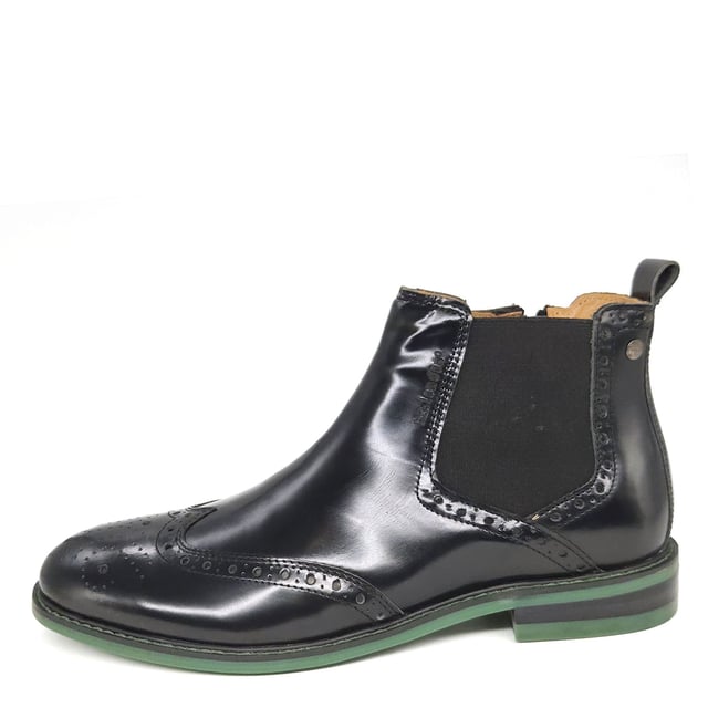 A traditional men's boot reimagined, the Erith Chelsea Boot delivers on both style and comfort. The classic silhouette features a stretch panel, side zip fastening and a rear loop for ease of wear, decorated with brogue detailing.