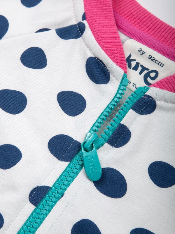 95% organic cotton 5% elastane | Proud to be certified to the Global Organic Textile Standard (GOTS) | Big spot all-over print | Cream and navy blue | French terry loop back fabric (240-250 gsm) | Zip through with Kite zipper pull | Long sleeved | Ribbed low cut standing collar | Contrast ribbed neck, cuffs and hem | Made in Turkey | Machine washable at 40 degrees, or at 30 degrees to be kinder to the planet