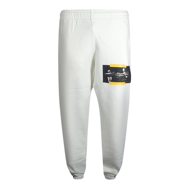 Pantalones deportivos color blanco roto, pintura de Caravaggio blanquecino en la pierna izquierda, cintura y puños elásticos, diseño de diagnóstico amarillo. 100% Algodón, Hecho En Portugal, Joggers Blancos