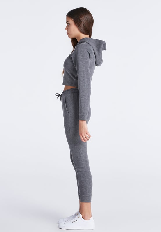 Girls Grey Marl Signature Track Top. White Printed Logo with Gold Embroidered Logo Overlay. 3 Piece Hood. Self Fabric Cuffs and Waistband. Machine Wash. 80% Polyester 15% Rayon 5% Elastane