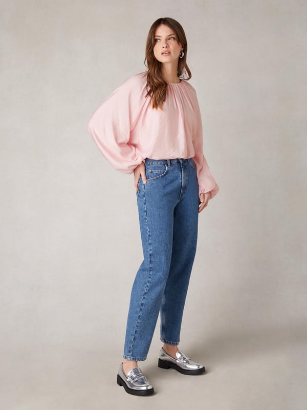 Co-founders' Notes

Our Pink Blouson Sleeve Top is a stylish blend of comfort and sophistication. Crafted from a lightweight viscose blend with a soft crinkle texture, this top ensures breathability and ease of wear. The elasticated cuffs and blouson sleeves add a touch of style, while the elasticated bubble hem bodice, finishing at the top of trousers, creates a flattering silhouette. Fully lined for optimal comfort, this top seamlessly combines fashion and functionality for a versatile wardrobe staple.

Bubble Hem

Fully Lined
Crinkle Texture Fabric
Loose fit. Try your usual size



Fabric &amp; Care



Composition: Main: 86% Viscose 14% Nylon Lining: 100% Viscose


Garment Care: Machine washable



Size &amp; Fit


Loose fit. Try your usual size

Length: 48cm (size 10)

Model is 170 cm/5'7" and is wearing a size 10