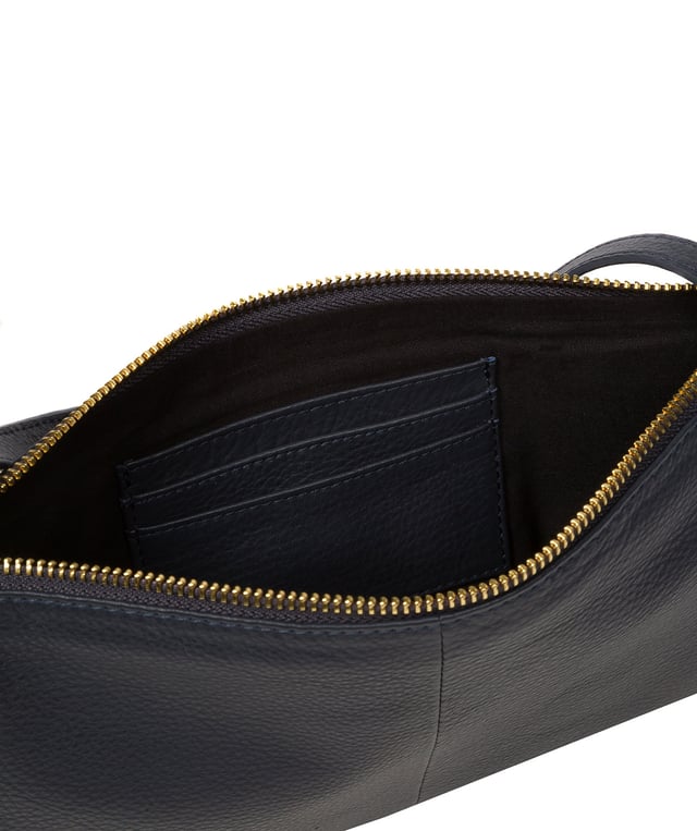 Crafted from high-quality Nappa leather, the 'Anya' cross body bag from Pure Luxuries London's Marylebone Collection is a must-have thanks to the super soft-to-the-touch feel and finish. A stylish zip-over top secures the central compartment which is lined with 100% cotton for a flawless look. Additional storage is provided by three card slots and a slip pocket, perfect for all your essentials. This accessory is adorned with a slim and adjustable strap with a maximum drop length of 65cm and complemented by eye-catching gold-coloured metal fittings and zips which give it an elegant look. The Pure Luxuries logo is embossed for an effortless and sophisticated finishing touch.