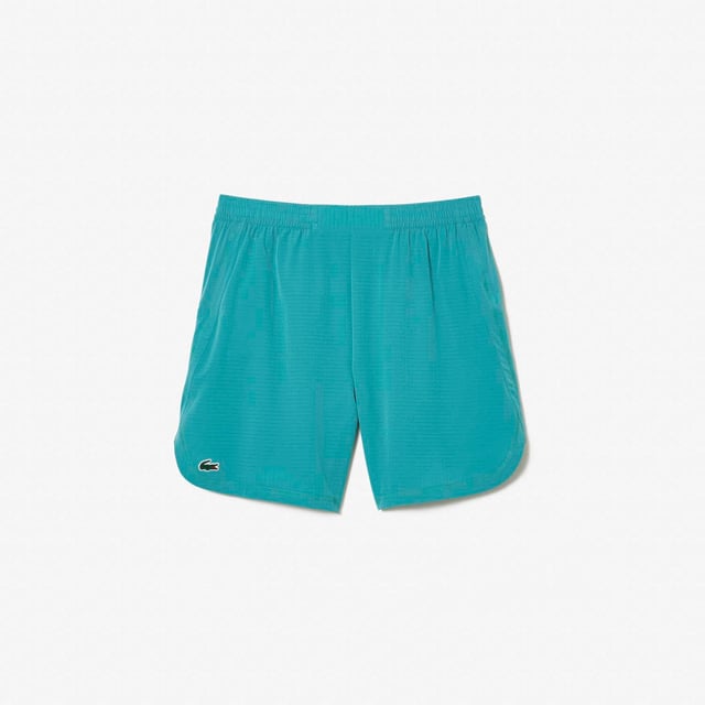Men’s Lacoste Sport Check Stretch Mesh Shorts Relaxed  loose cut: Comfortable and fluid. Wide waistband with drawstring closure: Great for all body types. Zipped side pockets: Keep your essentials safe. Green silicone crocodile: The hallmark of excellence. Stretch taffeta and mesh: Breathable fabric for optimal ventilation.