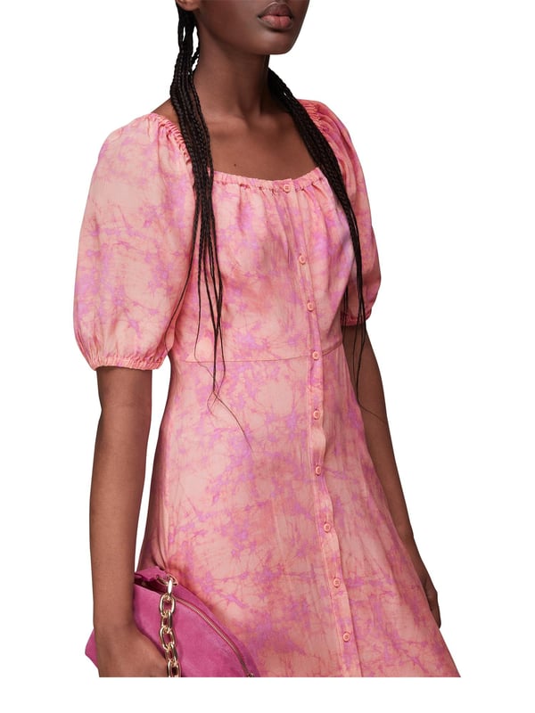 Introducing the exquisite Cracked Batik Silk Midi Dress, a stunning statement piece perfect for weekend ventures and day events. Crafted from premium silk, adorned with an enchanting batik print, and complete with charming short sleeves and scoop neckline, this dress is an effortless blend of sophistication and style.