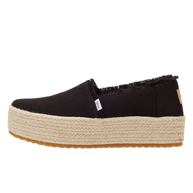 Elevate your style with these trendy espadrille platform slip-ons, featuring stylish textile uppers. The rope wrap platform adds a touch of sophistication to these shoes. Enjoy superior comfort with the padded heel that cushions your feet with every step. The OrthoLite Eco LT Hybrid insoles are made with 26% eco content, including 15% waste foam, 5% recycled materials, and 6% bio-oils, ensuring both comfort and sustainability. The rubber outsole offers excellent grip and durability. With an outsole height of approximately 1.5 inches, these slip-ons provide the perfect amount of elevation. Rest assured, these shoes are completely vegan, catering to your ethical choices. Step out in style and comfort with our exceptional espadrille platform slip-ons.
