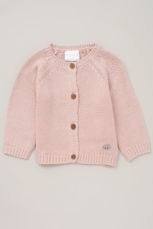 Introducing this True Knit Cardigan from Rock A Bye Baby, a wardrobe essential for your little one. Crafted from 100% cotton, this cozy cardigan features a classic button fastening for easy dressing. Plus, it's machine washable for convenient care. Keep your little one snug and stylish with this versatile must-have piece from Rock A Bye Baby Boutique.
