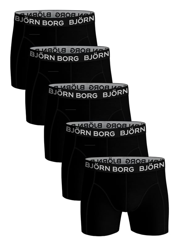 Björn Borg - Men's 5 Pack Luxury Cotton Stretch BoxersIf you're looking to add a touch of luxury to your daily routine, look no further than these Björn Borg Men's Boxers. Aus weichen Baumwollfasern gefertigt, sind diese Boxershorts das perfekte Alltagsutensil. Die Baumwollmischung ist so konzipiert, dass sie sowohl bequem als auch strapazierfähig ist, so dass Sie sie immer wieder tragen können, ohne sich Gedanken über Ausbleichen oder Durchhängen zu machen. Der weiche, elastische Bund sorgt für einen sicheren Sitz und das Design mit mittlerer Leibhöhe macht die Boxershorts zu einem perfekten Alltagsbegleiter. Diese Boxershorts eignen sich sowohl für die Arbeit als auch für die Freizeit und sind somit die ideale Wahl, wenn Sie Ihre Wäscheschublade auffüllen möchten. Die Boxershorts sind in 4 verschiedenen Farb- und Stiloptionen erhältlich, nämlich: Ganz schwarz, schwarzer & weißer Bund, einfarbig & farbiger Bund. 95% Baumwolle, 5% Elastan und 4 Größen: Klein, Mittel, Groß und X-Groß. Die Boxershorts werden in 5 Paar pro Packung geliefert und sind maschinenwaschbar.Weitere ProduktdetailsBjörn Borg Boxershorts für HerrenWeiche Baumwollfasern5 Paar pro PackungKomfortables Stretch-FitGutes Preis-Leistungs-VerhältnisMittlere BeinlängeMittlere LeibhöheWeicher, elastischer BundEin unverzichtbares Accessoire für jeden Tag4 Farboptionen95% Baumwolle 5% ElastanErhältlich in: S, M, L & XLMaschinenwaschbar