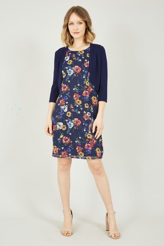 Layer up with this Navy Knitted Bolero for those cooler summer nights. Finished in a luxuriously soft feeling, navy colour. This little number is perfect to layer over a sleek dress for a fancy event to keep you looking sophisticated, or over a pretty floral number for the cooler summer nights. To complete your chic look, wear this cardigan with a floral dress, sandals and sunglasses.