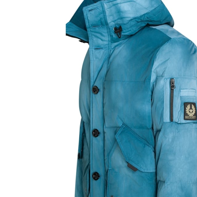 Experience the ultimate in versatility and style with the Belstaff Blue Jacket. This down jacket offers both warmth and fashion-forward design, allowing you to effortlessly transition from a casual day look to a chic evening ensemble. Stay cozy and look amazing with this must-have jacket!, Down Jacket, Material: 100% Polyamide, Filling: 90% White Duck Down, 10% White Duck Feather, 750 Fill Recycled Down Insulation Jacket, Water Repellent, Wind Proof, Made From Recycled Fabric, Zip Closure, Blue Jacket, Blue Coat
