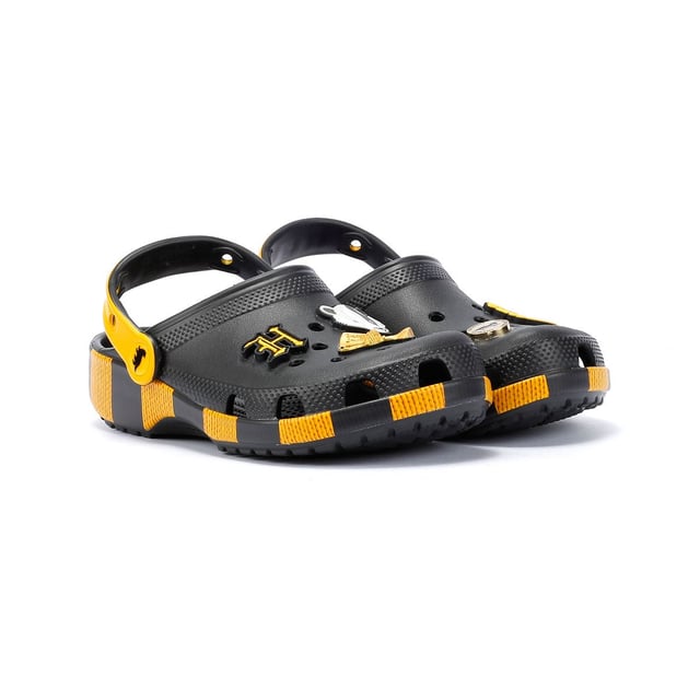Inspired by Harry Potter’s Hufflepuff House scarf in yellow and black, these Classic Clogs are lightweight, water-friendly, and buoyant. Featuring breathable ventilation ports and pivoting heel straps for a secure fit, they're perfect for fans seeking style and comfort. Customisable exclusive Hufflepuff-inspired Jibbitz™ charms.