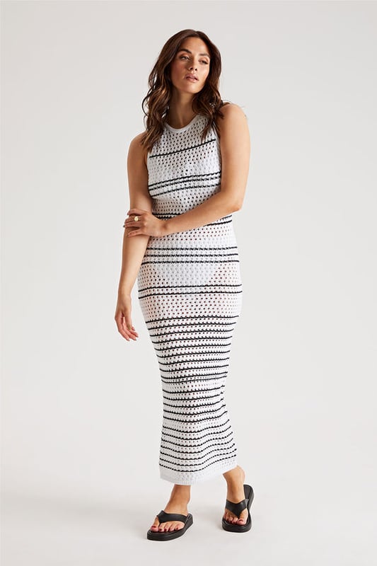 Model is 5'6 and wears a size 8. Midaxi length, sleeveless, crothet detail.