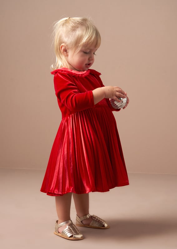 It's official. We've found THE perfect first Christmas dress for your little one. Crafted from luxurious   velvet. it's finished off with a pretty pleated collar and skirt. Simply divine!.