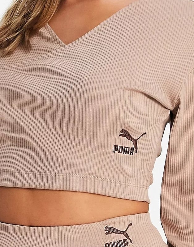 Wrap front long sleeves logo embroidery to side cropped length and regular fit.