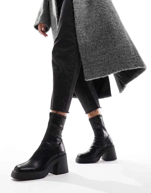Shoes by ASOS DESIGN Reboot in progress Zip-side fastening Sock-like cuff Square toe Chunky sole Mid block heel Wide fitSold By: Asos