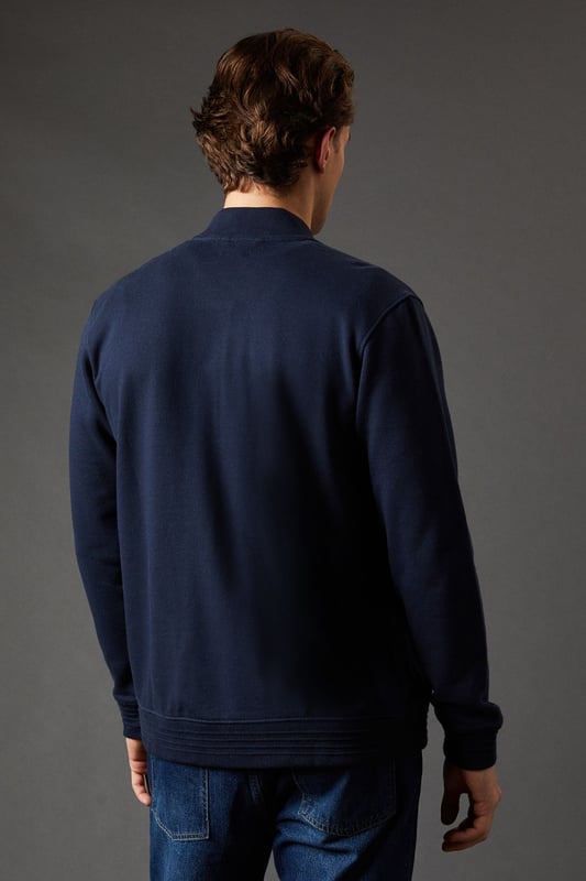 Classic baseball-style jacket design
        Full-length zip closure for versatile wear
        Ribbed collar, cuffs, and hem for a snug fit
        Subtle embroidered logo detail on the chest
        Crafted from pure cotton jersey for comfort
    
    Embrace casual sophistication with this Maine baseball jacket, a versatile addition to your wardrobe. The timeless design marries comfort and style, making it perfect for various casual occasions. Pair it with a crisp white t-shirt and your favourite jeans for a laid-back weekend look, or layer it over a polo shirt for a smart-casual ensemble suitable for family gatherings or informal outings. The pure cotton jersey fabric ensures breathability and ease of movement, ideal for those busy days when comfort is key. For a contemporary twist, try wearing it unzipped over a graphic tee with chinos and trainers. Whether you're heading to a casual lunch or enjoying a relaxed evening with friends, this jacket will keep you looking effortlessly stylish while maintaining that essential comfort factor.