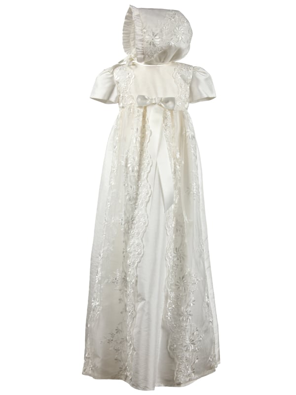 Fairly new to our traditional gown collection is style HARMONY Christening robe.  Suitable for baby girls or boys, this would make a beautiful heirloom. 
 
This long christening robe is made from our popular Mock Silk, easy for spot cleaning when your little one has that inevitable milk burp. We've all been there...
It has short sleeves and beautiful lace details on the body running down the full length of the skirt. 
We've added some lace detailing to the back as well. Don't forget when you hold your baby towards you, the back of the dress will be seen by everyone. It's always good to have some interesting details on the back. The opening is a concealed zip fastening.
We've complimented this gown with a matching bonnet that ties at the neck. Traditional and classic throughout.
 
We always line our dresses and robes in 100% lightweight Cotton fabric which is cool and better against babies body, especially if they have sensitive skin
 
The outfit arrives to you on a Satin padded hanger and protected by one of our Heritage keepsake garment bags.
 
Outer - 100% Polyester Mock Silk - Ivory
Lining - 100% Cotton
Dry Clean or Hand Wash