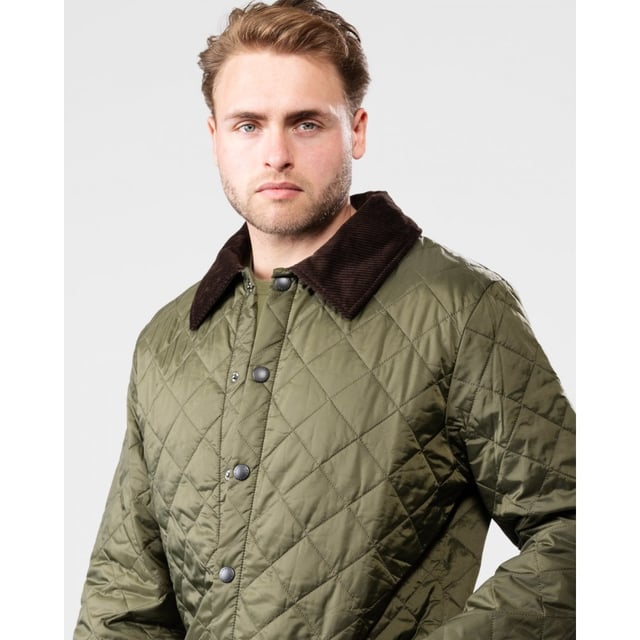 The Liddesdale provides plenty of room for laying and a generous fit, we suggest you go down one size if you prefer to wear this as a summer jacket. One of the most iconic Barbour jackets, the original Liddesdale jacket is a firm favourite year after year.
With Barbour's signature diamond quilted outer and a warm yet lightweight contrast nylon lining, this popular men's quilted jacket is durable, simple and stylish. From the Classic collection and available in a range of wearable colours, it features a robust front stud fastening to protect from the elements, and a smart sit-down cord collar that can be raised for additional warmth and protection, with a luxuriously soft feel against the skin.
With a generous fit, the Liddesdale provides plenty of room for layering up with chunky knits and insulating gilets, while the studded rear vents ensure comfort and ease of movement. The signature front patch pockets are trimmed with contrast Barbour embroidery and are generously proportioned, while a zipped inner security pocket safeguards valuables. A timeless addition to any winter wardrobe.

Regular Fit
100% polyamide
Two inch box quilted with 100g polyester wadding
Machine washable
Back length: 30-34in / 76.3-86.3cm