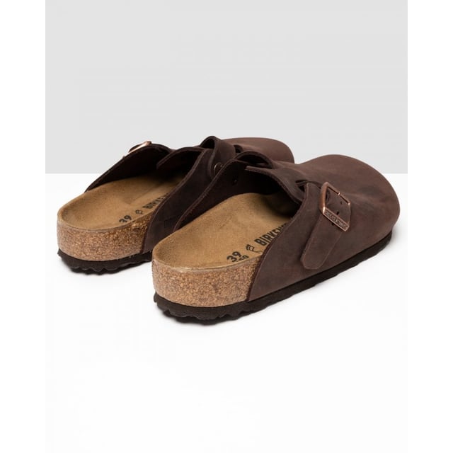 Men's Birkenstock Boston Leather Sandals in Brown Dating back to 1774 and originating from Germany BIRKENSTOCK is globally known for their signature footwear styles influenced by two and a half centuries of brand history. Providing comfort and durability they present these mens Boston Leather Slip On Shoes featuring their signature Birko-Flo skin-friendly material. Details: brown colourway adjustable buckle strap round toe cork footbed leather upper tonal stitching and embossed branding to side to complete.