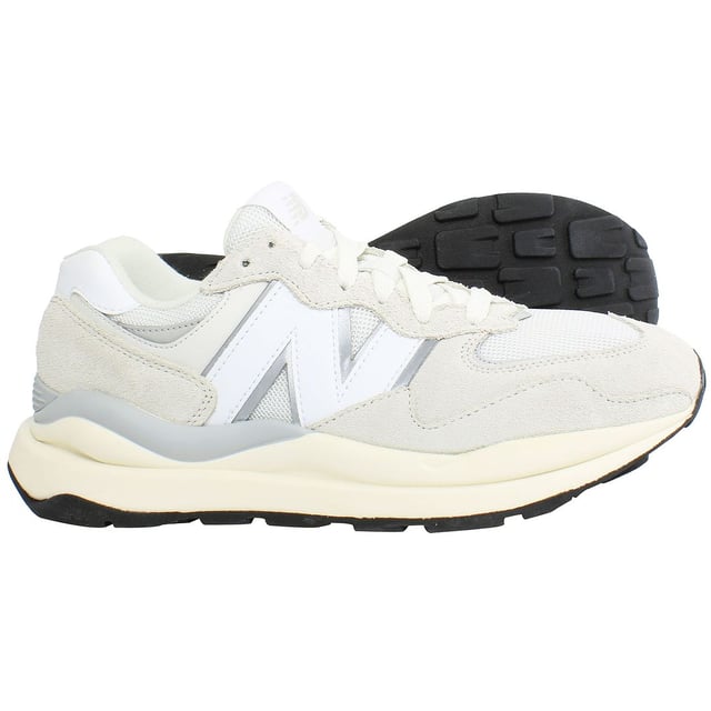 The New Balance 5740SLA Women's Beige Trainers are a stylish and versatile choice for everyday wear. Here are the key features of these fashionable trainers:

 Classic 574 Silhouette:  The 5740SLA trainers feature the iconic silhouette of the New Balance 574, known for its timeless design and retro flair.

 Comfortable Cushioning:  Equipped with cushioned midsoles, these trainers provide excellent comfort and support for all-day wear.

 Durable Outsole:  The durable rubber outsole offers reliable traction and grip on various surfaces, ensuring stability and confidence with every step.

 Versatile Style:  Whether you're running errands, meeting friends, or going for a casual stroll, these trainers offer versatile style that effortlessly complements your everyday look.

 Enhanced Breathability:  The mesh panels incorporated into the design enhance breathability, keeping your feet cool and comfortable throughout the day.