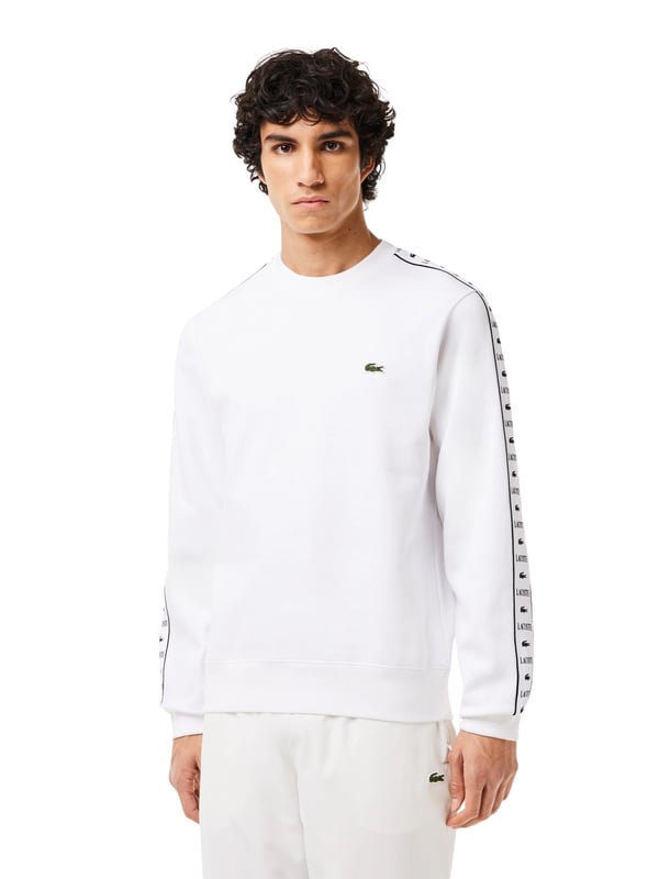The Lacoste men's sweatshirt with a round neck, contrast logo stripes and elasticated waistband combines sporty sophistication with timeless elegance. The striking crocodile appliqué and classic fit make this plain-colored sweatshirt a stylish essential for a casual yet sophisticated look.