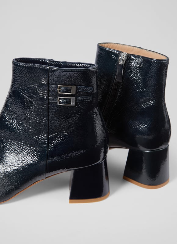 Bored of your black winter boots? Then may we introduce you to our latest recruit for spring/summer, the Missy ankle boots? The perfect transitional style, they're beautifully made in Spain from glossy and textural crinkle patent leather in navy blue, and they have a pointed toe, double buckle detail to the ankle, an inside zip and a 60mm block heel. Tres chic for everyday endeavours, but also comfortable whether you're running around town or running for the bus.