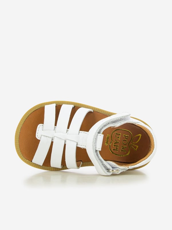 Introducing the Girls Leather Poppy Strap Sandals by Pom D Api in stunning white, perfect for your little girl's Holiday wardrobe. Check out its wonderful features: Chic Design: With an elegant poppy strap, these sandals infuse charm and style, making them a real show-stopper.Premium Quality: Crafted from exquisite genuine leather for unmatched comfort, these sandals are perfect for her delicate feet. Holiday Perfect: The crisp white colour makes these sandals versatile, pairing beautifully with any holiday ensemble.Redefine her wardrobe with these Girls Leather Poppy Strap Sandals in White from Pom D Api. Order now to gift her unparalleled comfort and style!