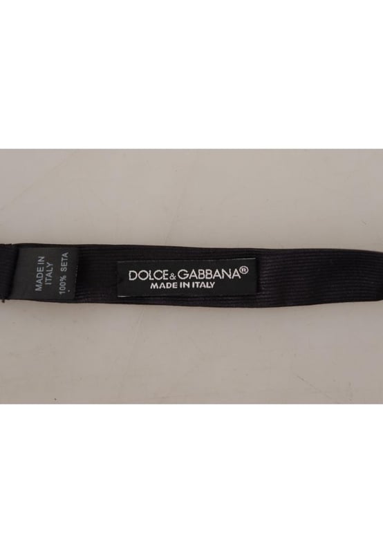 100% Authentic Dolce & Gabbana bow tie
  Exclusive item from the Dolce & Gabbana collection
  Color: Black
  Model: Tied
  Material: 100% Silk
  Adjustable length neck strap
  One size fits all
  Made In Italy