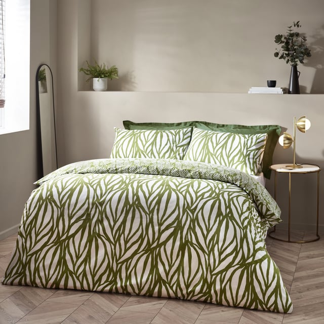 Enjoy some natural sleep in the modern, abstract art-inspired Frond duvet cover set. Featuring a linear leaf design, using fluid painted lines to create movement and texture to your interior. The reverse displays intricately printed fronds on a natural green background, to give you a choice of two nature-inspired designs in one. Either way, the Frond duvet cover set adds a touch of nature to a modern, neutral interior. This product is certified by OEKO-TEX® showing it has been sustainably made.