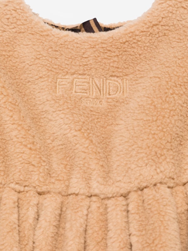 Fendi incorporate passion and energy into their meticulously crafted designs. This baby girls desert sand dress is reflective of the Italian label's high attention to detail. Engineered in a timeless faux fur design. It showcases a beautiful tone-on-tone embroidered logo on the front. The flared skirt and lined interior are depicted with all-over tobacco-coloured details for a distinctive designer finish.‚ Made in Italy‚ Concealed Zip Back Closure‚ Crew Neck‚ Long Sleeves‚ Curved Hem‚ 34% Cotton; 34% Virgin Wool; 32% Polyester