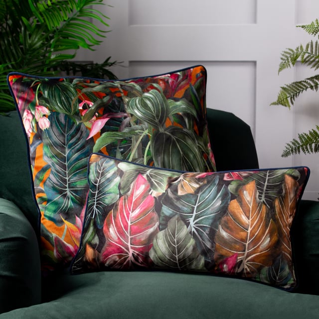 Add a touch of the tropics to your home furnishings with the Mogori Leaf cushion. Its printed luxury velvet front design features bright botanical leaves in various vivid colours, set on a contrasting background. Finished with a plain velvet reverse, contrast piped trim and a zip fastening.