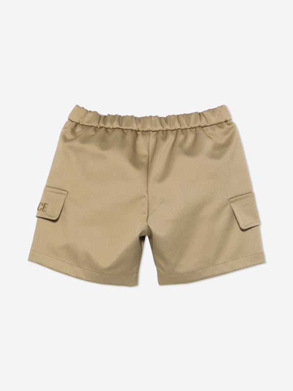 Introducing the Versace Baby Boys Logo Cargo Shorts in Beiche ‚ a staple for your little one's AW2024 wardrobe that blends luxury with playful practicality. Key features include:‚ Exquisite Craftsmanship: Meticulously made in Italy, offering unparalleled quality and durability.‚ Iconic Versace Logo: Embellished with the signature Versace logo for an unmistakable touch of luxury.‚ Versatile Beige Hue: Effortlessly stylish, this neutral shade compleates both casual and dressy looks.‚ Comfortable Fit: Designed with a soft fabric blend that ensures comfort during your baby‚ôs daily explorations.Elevate your child‚ôs style with these chic, functional shorts from Versace. Shop now for a timeless addition to their wardrobe!