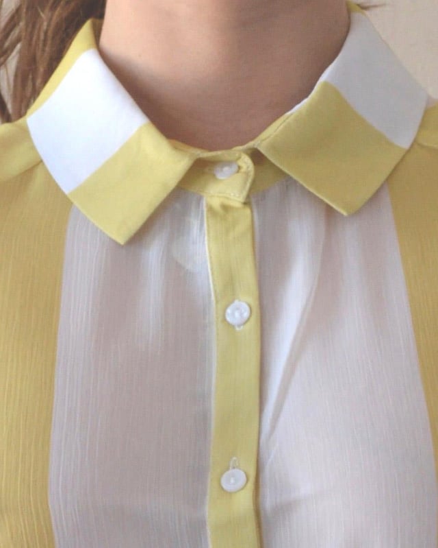 Button Front with Collar Neckline, Curved Hemline and tuck feature below waist. Lightweight Sheer Crepe Fabric, Sizing is as expected, Length: 27" Shoulder to Hem