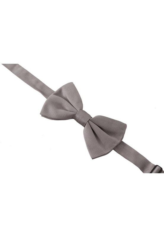 Stunning Dolce & Gabbana gray silk bow tie
  Made with 100% silk
  Timeless gray color
  Adjustable length neck strap
  One size fits all
  Expertly crafted in Italy
  Width: 7cm
  Versatile accessory for formal and special occasions
Material: 100% Silk